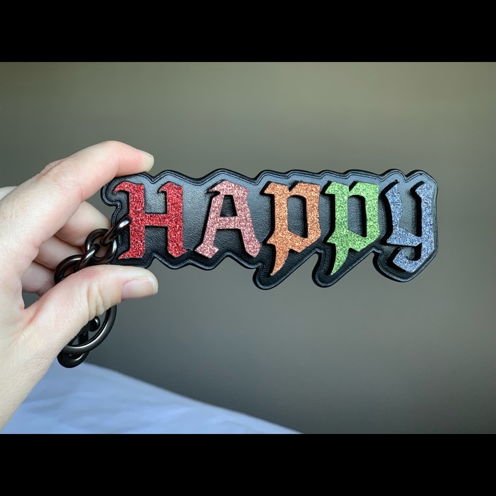 Coach x Disney “Happy” Keychain